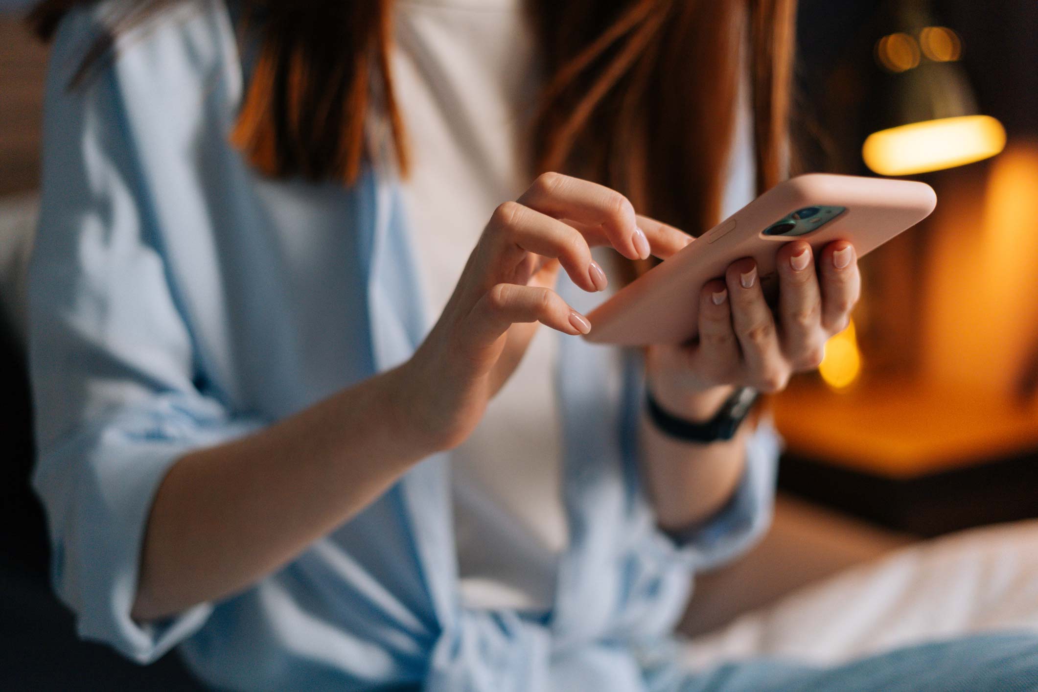 Woman booking holiday on phone