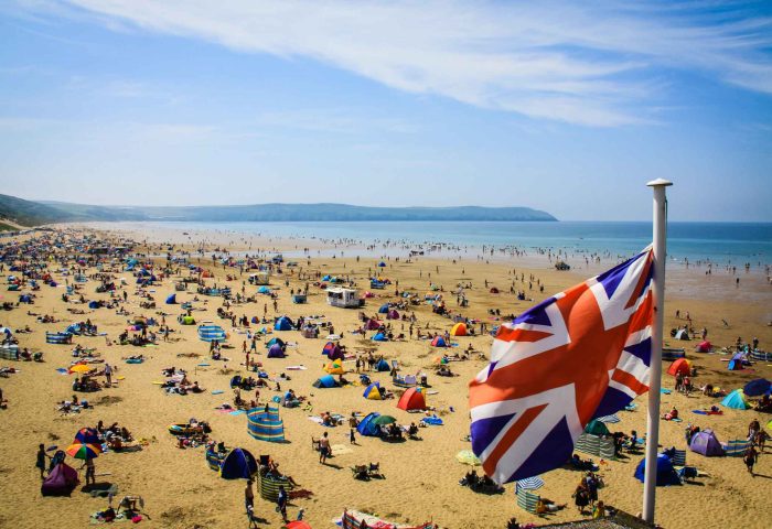 Woolacombe Beach in North Devon With Union FLag flying on a Bank Holiday Weekend