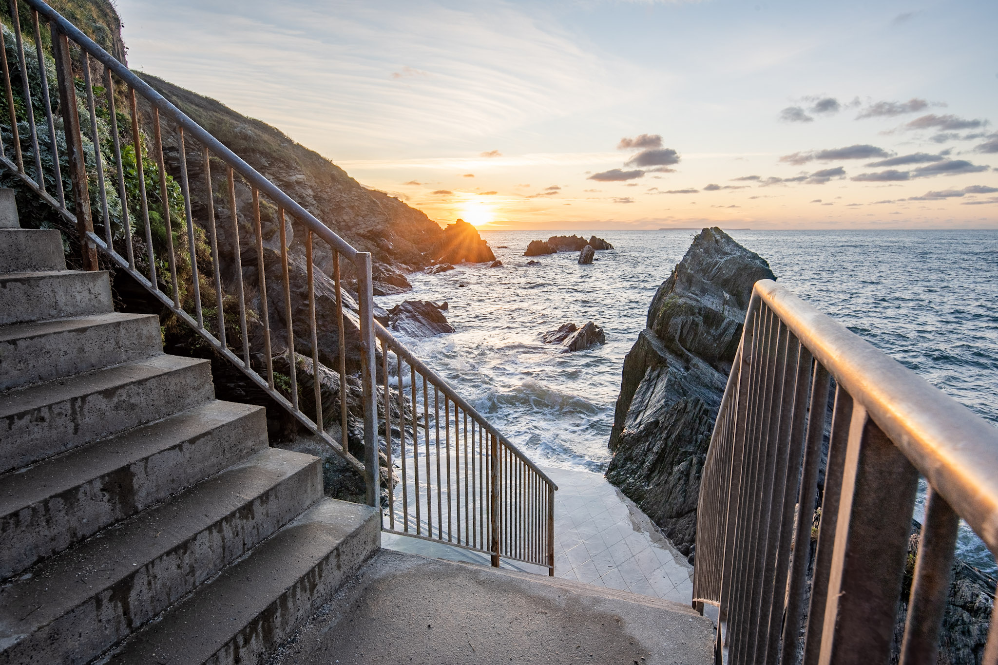 Steps down to Combesgate beach at sunset