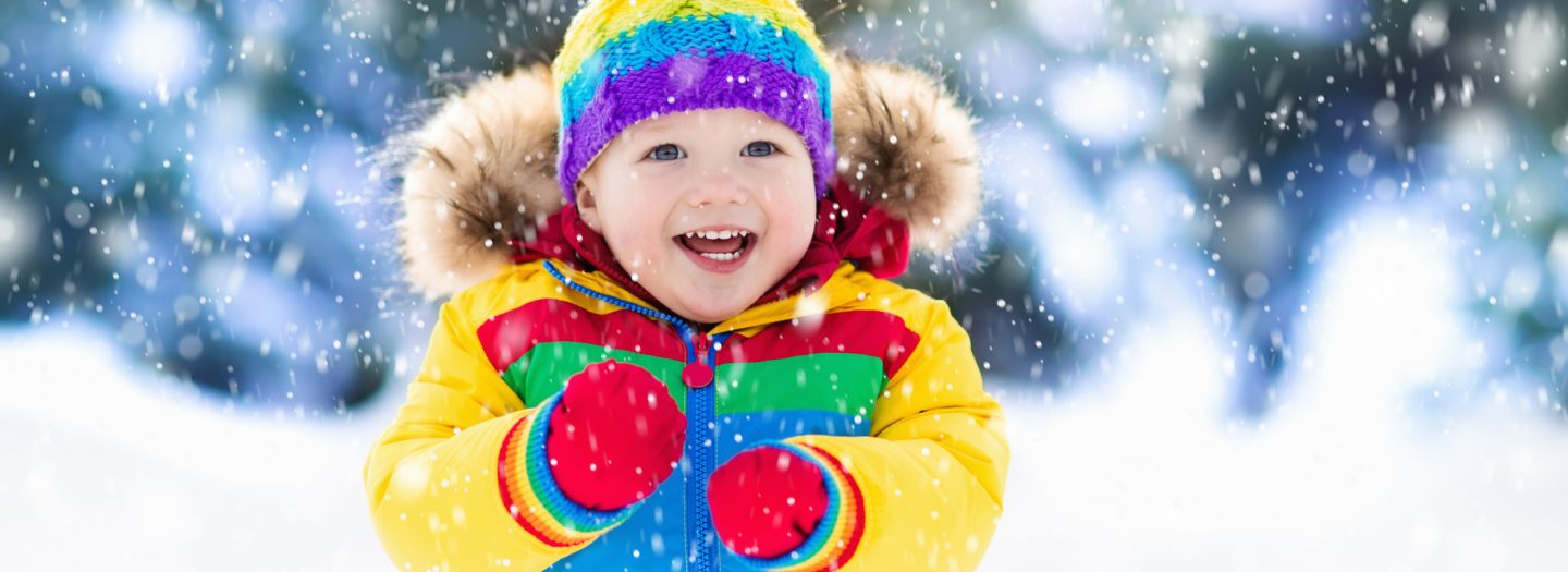 Toddler playing in snow